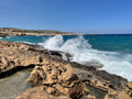 Relaxing ocean waves crashing against a rocky coastline